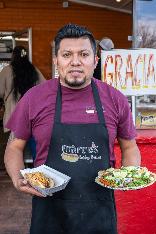 Owner of Marcos holding food